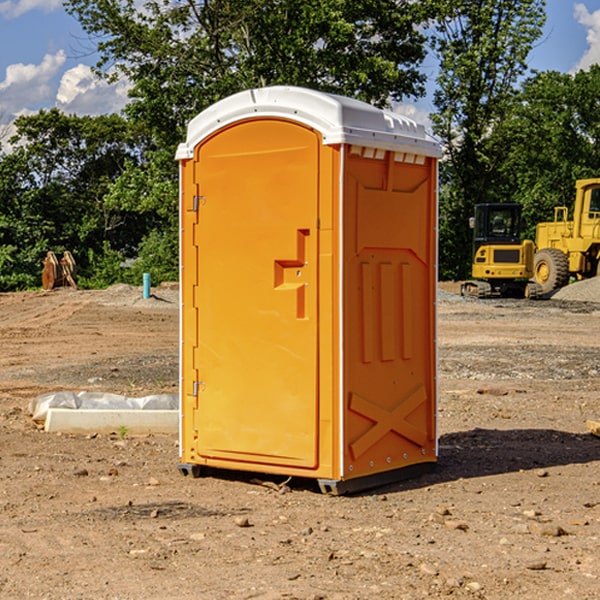 what is the cost difference between standard and deluxe portable restroom rentals in Harrison